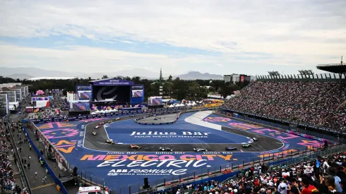 MEXICO CITY, MEXICO – JANUARY 13: Pascal Wehrlein of TAG Heuer Porsche Formula E Team, Porsche 99X Electric Gen3, leads Sebastien Buemi of Envision Racing, Jaguar I-TYPE 6, and Maximilian Gunther of Maserati MSG Racing, Maserati Tipo Folgore, and the rest of the field through the stadium during the Mexico City ePrix at Autodromo Hermanos Rodriguez on January 13, 2024 in Mexico City, Mexico. (Photo by Handout/Jaguar Racing via Getty Images)
