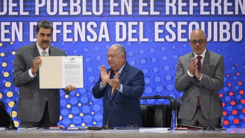 CARACAS, VENEZUELA – DECEMBER 4: (L-R) President of Venezuela Nicolas Maduro, Rector of the National Electoral Council Elvis Amoroso and President of the National Assembly Jorge Rodriguez, show the referendum notification act during a press conference on the day after Venezuelans voted in the referendum about the border conflict with neighboring country Guyana about the potential oil-rich Esequibo region on December 4, 2023 in Caracas, Venezuela. Voters rejected the International Court of Justice's (ICJ) jurisdiction over the area in dispute and backed the creation of a new state. Political analysts see the referendum as a way of the government to show its muscle ahead of the 2024 presidential elections. (Photo by Gaby Oraa/Getty Images)
