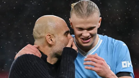 Pep Guardiola talks to Erling Haaland  (Photo by Michael Regan/Getty Images)
