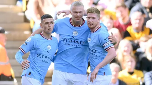 Erling Haaland of Phil Foden and Kevin De Bruyne . (Photo by Laurence Griffiths/Getty Images)
