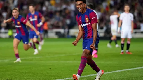 BARCELONA, SPAIN – SEPTEMBER 29: Lamine Yamal of Barcelona celebrates as Sergio Ramos of Sevilla scores an own-goal during the LaLiga EA Sports match between FC Barcelona and Sevilla FC at Estadi Olimpic Lluis Companys on September 29, 2023 in Barcelona, Spain. (Photo by Alex Caparros/Getty Images)
