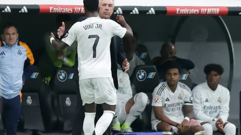 MADRID, SPAIN – NOVEMBER 09: Vinicius Junior (L) of Real Madrid CF celebrates scoring their opening goal with his coach Carlo Ancelotti (R) during the LaLiga match between Real Madrid CF and CA Osasuna at Estadio Santiago Bernabeu on November 09, 2024 in Madrid, Spain. (Photo by Gonzalo Arroyo Moreno/Getty Images)
