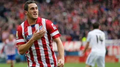 REFILE - WITH ADDITIONAL INFORMATION Atletico Madrid's Jorge "Koke" Resurrecion celebrates his goal against Real Madrid during their Spanish first division soccer match at Vicente Calderon stadium in Madrid March 2, 2014. REUTERS/Andrea Comas (SPAIN - Tags: SPORT SOCCER)