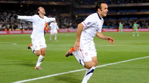 Landon Donovan of USA celebrates the winning goal with team mates
