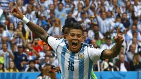Argentina's Marcos Rojo celebrates after scoring a goal during the 2014 World Cup Group F soccer match against Nigeria at the Beira Rio stadium in Porto Alegre June 25, 2014. REUTERS/Stefano Rellandini