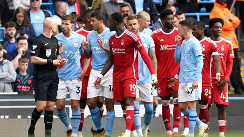 Ten man Manchester City beat Forest to maintain perfect start
