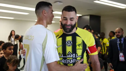 Cristiano Ronaldo of Al Nassr and Karim Benzema of Al Ittihad talk prior the Saudi Pro League match between Al-Ittihad v Al-Nassr at King Abdullah Sports City on December 6, 2024 in Jeddah, Saudi Arabia.