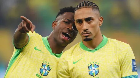 Vinicius Junior and Raphinha of Brazil talk as they line up prior to the South American FIFA World Cup 2026 Qualifier match between Brazil and Uruguay at Arena Fonte Nova on November 19, 2024 in Salvador, Brazil.