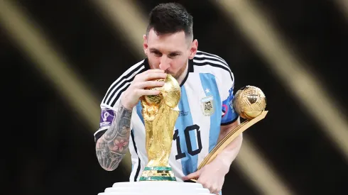 Lionel Messi of Argentina kisses the FIFA World Cup Qatar 2022 Winners' Trophy on December 18, 2022 in Lusail City, Qatar.
