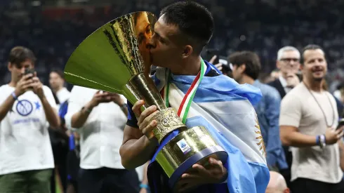 Lautaro Martinez of FC Internazionale kisses the Serie A TIM Scudetto title trophy at full-time following the team's draw in the Serie A TIM match between FC Internazionale and SS Lazio in 2024.