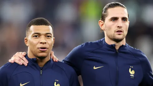 Kylian Mbappe and Adrien Rabiot line up for the national anthem prior to the FIFA World Cup Qatar 2022 Round of 16 match between France and Poland.