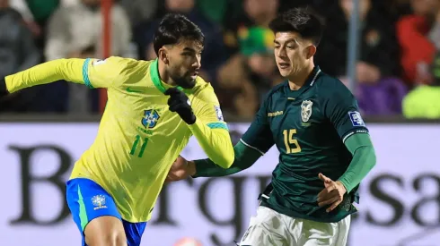 Lucas Paqueta of Brazil is challenged by Gabriel Villamil of Bolivia during the South American FIFA World Cup 2026 Qualifier match.