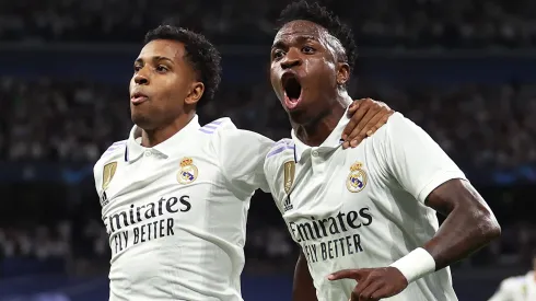 Vinicius Junior and Rodrygo Goes celebrate after Real Madrid's goal vs. Manchester City in a 2023 Champions League match.
