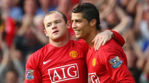 Cristiano Ronaldo and Wayne Rooney playing for Manchester United.