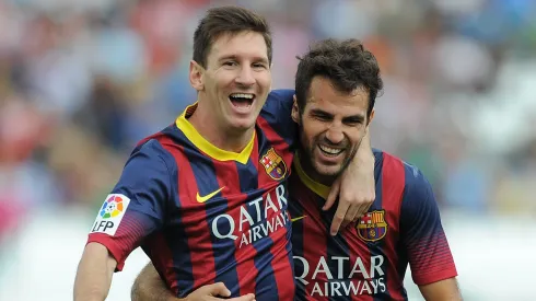 Lionel Messi and Cesc Fabregas playing for Barcelona.