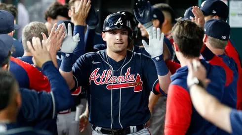 ARLINGTON, TEXAS - APRIL 29: Austin Riley #27 of the Atlanta Braves is greeted by teammates in the dugout after hitting a two-run home run against the Texas Rangers in the first inning at Globe Life Field on April 29, 2022 in Arlington, Texas. (Photo by Richard Rodriguez/Getty Images)