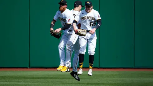 PITTSBURGH, PA - MAY 11: Bryan Reynolds #10, Jack Suwinski #65 and Ben Gamel #18 of the Pittsburgh Pirates celebrates after defeating the Los Angeles Dodgers 5-3 during the game at PNC Park on May 11, 2022 in Pittsburgh, Pennsylvania. (Photo by Justin K. Aller/Getty Images)