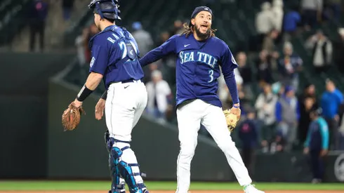 SEATTLE, WASHINGTON - MAY 10: Cal Raleigh #29 of the Seattle Mariners and J.P. Crawford #3 celebrate after the 5-4 win against the Philadelphia Phillies at T-Mobile Park on May 10, 2022 in Seattle, Washington. (Photo by Abbie Parr/Getty Images)