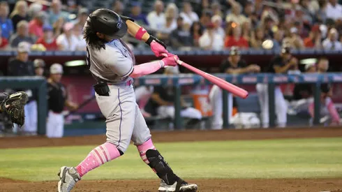 PHOENIX, ARIZONA - MAY 08: Connor Joe #9 of the Colorado Rockies hits a single against the Arizona Diamondbacks during the fifth inning of the MLB game at Chase Field on May 08, 2022 in Phoenix, Arizona. (Photo by Christian Petersen/Getty Images)