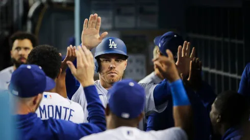 LOS ANGELES, CALIFORNIA - MAY 12: Freddie Freeman #5 of the Los Angeles Dodgers celebrates in the dugout after scoring a run in the eighth inning against the Philadelphia Phillies at Dodger Stadium on May 12, 2022 in Los Angeles, California. (Photo by Meg Oliphant/Getty Images)