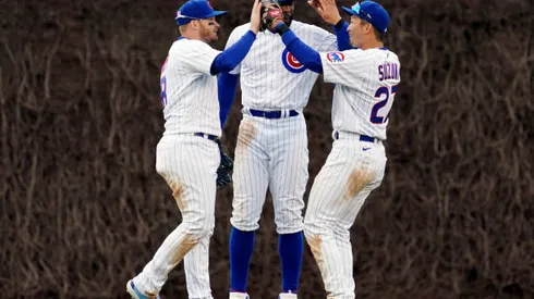 CHICAGO, IL - APRIL 07: Ian Happ #8, Jason Heyward #22 and Seiya Suzuki #27 of the Chicago Cubs celebrate after the Cubs defeated the Milwaukee Brewers at Wrigley Field on Thursday, April 7, 2022 in Chicago, Illinois. (Photo by Nuccio DiNuzzo/MLB Photos via Getty Images)