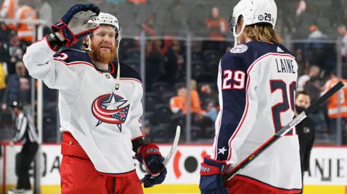 PHILADELPHIA, PA - APRIL 05: Jakub Voracek #93 and Patrik Laine #29 of the Columbus Blue Jackets celebrate after defeating the Philadelphia Flyers 4-2 at the Wells Fargo Center on April 5, 2022 in Philadelphia, Pennsylvania. (Photo by Len Redkoles/NHLI via Getty Images)