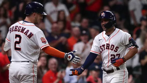 HOUSTON, TEXAS - MAY 03: Jose Altuve #27 of the Houston Astros is congratulated by Alex Bregman #2 after hitting a home run in the seventh inning against the Seattle Mariners at Minute Maid Park on May 03, 2022 in Houston, Texas. (Photo by Bob Levey/Getty Images)