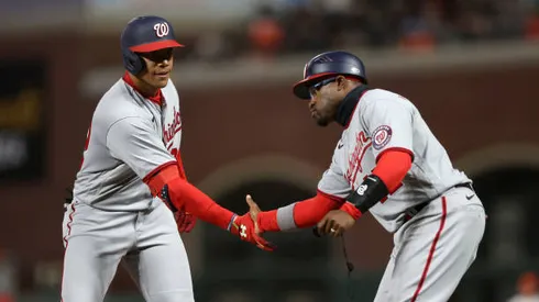 SAN FRANCISCO, CALIFORNIA - APRIL 29: Juan Soto #22 of the Washington Nationals is congratulated by first base coach Eric Young Jr. #12 after he hit a single that scored a run against the San Francisco Giants in the sixth inning at Oracle Park on April 29, 2022 in San Francisco, California. (Photo by Ezra Shaw/Getty Images)