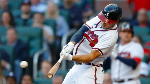 ATLANTA, GA - APRIL 27: Matt Olson #28 of the Atlanta Braves hits a double during the first inning of an MLB game against the Chicago Cubs at Truist Park on April 27, 2022 in Atlanta, Georgia. (Photo by Todd Kirkland/Getty Images)