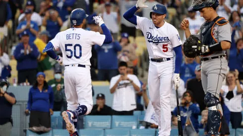 LOS ANGELES, CALIFORNIA - APRIL 30: Mookie Betts #50 of the Los Angeles Dodgers celebrates his home run with teammate Freddie Freeman #5 during the first inning against the Detroit Tigers at Dodger Stadium on April 30, 2022 in Los Angeles, California. (Photo by Katelyn Mulcahy/Getty Images)
