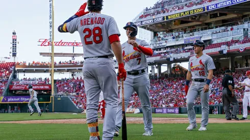 CINCINNATI, OHIO - APRIL 23: Nolan Arenado #28, Andrew Knizner #7, and Tommy Edman #19 of the St. Louis Cardinals celebrate after Knizner and Edman scored runs in the sixth inning against the Cincinnati Reds at Great American Ball Park on April 23, 2022 in Cincinnati, Ohio. (Photo by Dylan Buell/Getty Images)