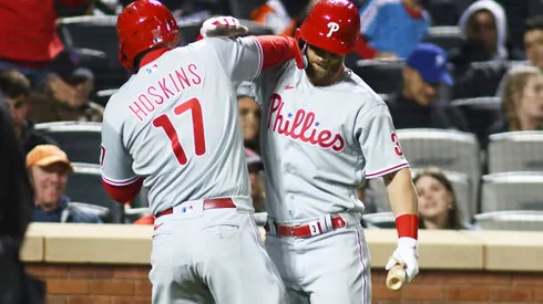NEW YORK, NEW YORK - APRIL 30: Rhys Hoskins #17 of the Philadelphia Phillies celebrates with Bryce Harper #3 after hitting a solo home run in the eighth inning against the New York Mets at Citi Field on April 30, 2022 in New York City. (Photo by Mike Stobe/Getty Images)