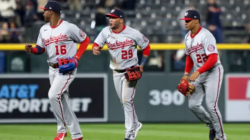 DENVER, CO - MAY 03: Victor Robles #16, Yadiel Hernandez #29 and Juan Soto #22 of the Washington Nationals celebrate after beating the Colorado Rockies 10-2 at Coors Field on May 3, 2022 in Denver, Colorado. (Photo by Michael Ciaglo/Getty Images)