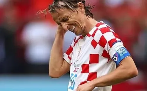 Lars Baron/Getty Images – Modric, principal jogador da Seleção Croata, lamentando lance contra Marrocos