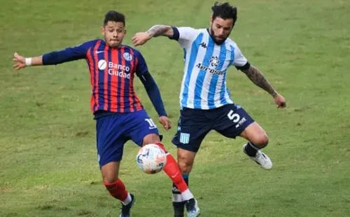 AVELLANEDA, ARGENTINA - MAY 09: Eugenio Mena of Racing Club fights for the ball with Oscar Romero of San Lorenzo during a match between Racing Club and San Lorenzo as part of Copa de la Liga Profesional 2021 at Presidente Peron Stadium on May 9, 2021 in Avellaneda, Argentina. (Photo by Rodrigo Valle/Getty Images)