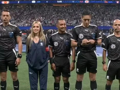 Who was the woman with the referees in the Argentina vs Canada match?
