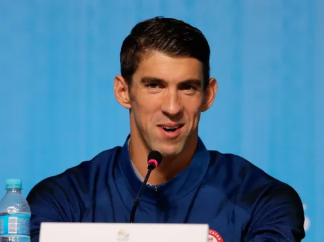 Why is Michael Phelps not competing at the Paris 2024 Olympic Games?
