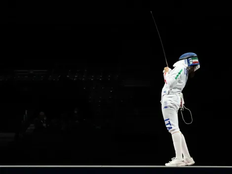 Why do fencers have a cable attached at the Paris 2024 Olympic Games?