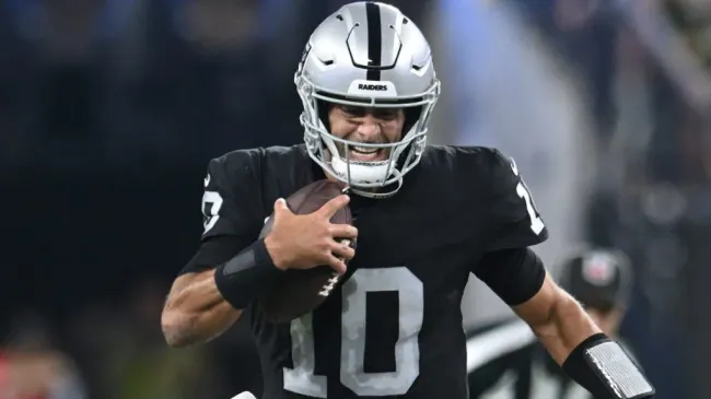 Garoppolo carrying the ball with one hand