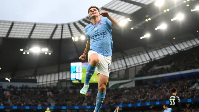 Julian Alvarez of Manchester City celebrates after scoring their team’s first goal during the Premier League match between Manchester City and Fulham FC at Etihad Stadium on November 05, 2022 in Manchester, England. (Photo by Shaun Botterill/Getty Images)