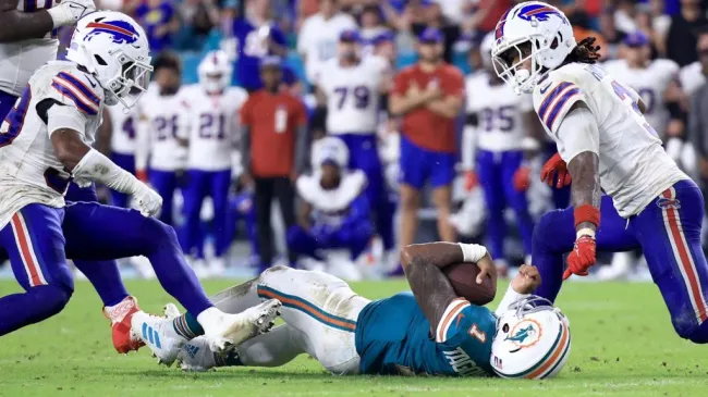 Tua Tagovailoa #1 of the Miami Dolphins lays on the ground after colliding with Damar Hamlin #3 of the Buffalo Bills during the third quarter in the game at Hard Rock Stadium on September 12, 2024 in Miami Gardens, Florida. (Photo by Carmen Mandato/Getty Images)