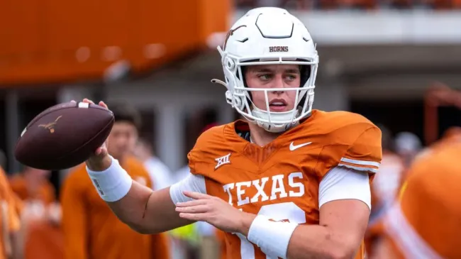 Arch Manning [16] of the Texas Longhorns warming up before the game vs the BYU Cougars at DKR-Memorial Stadium.