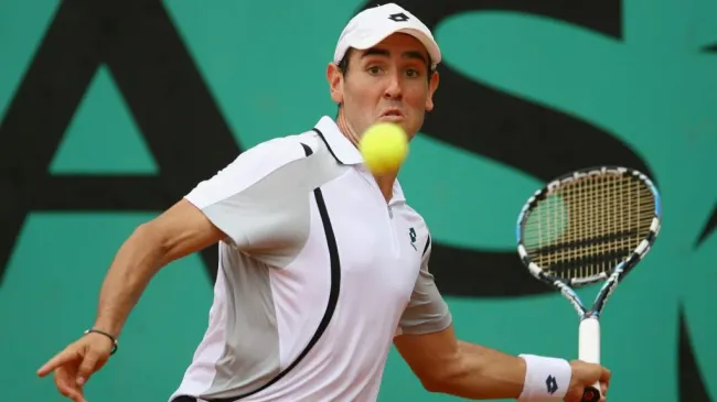 Wayne Odesnik plays a forehand against Guillermo Canas during the 2008 Roland Garros. (Julian Finney/Getty Images)