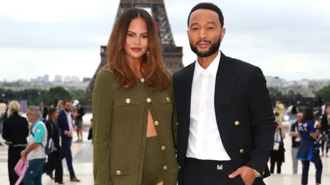 Chrissy Teigen and John Legend attend the red carpet ahead of the opening ceremony of the Olympic Games. (Source: Matthew Stockman/Getty Images)