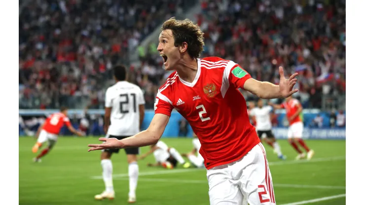 SAINT PETERSBURG, RUSSIA - JUNE 19:  Mario Fernandes of Russia celebrates the 2nd Russia goal scored by Denis Cheryshev of Russia during the 2018 FIFA World Cup Russia group A match between Russia and Egypt at Saint Petersburg Stadium on June 19, 2018 in Saint Petersburg, Russia.  (Photo by Julian Finney/Getty Images)
