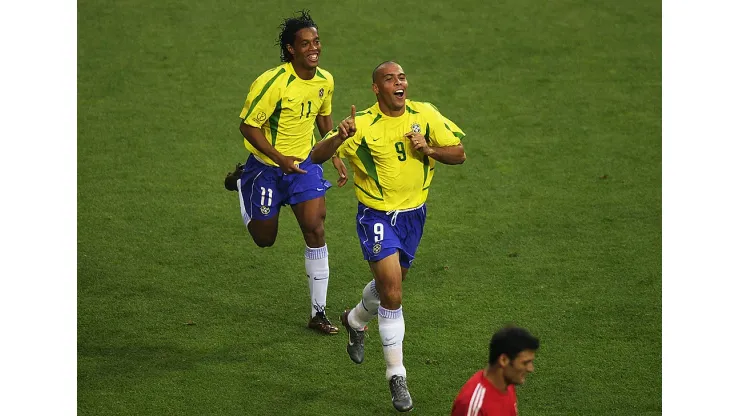 ULSAN - JUNE 3:  Ronaldo (left) of Brazil celebrates scoring the equalising goal against Turkey with team mate Ronaldinho during the Group C match of the World Cup Group Stage played at the Ulsan-Munsu World Cup Stadium, Ulsan, South Korea on June 3, 2002.  Brazil won the match 2-1. (Photo by Clive Brunskill/Getty Images)
