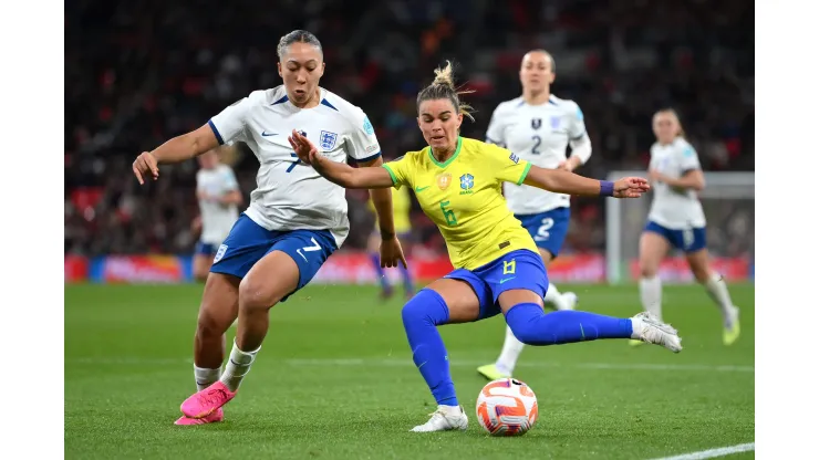 LONDON, ENGLAND - APRIL 06: Tamires of Brazil passes the ball whilst under pressure from Lauren James of England during the Women´s Finalissima 2023 match between England and Brazil at Wembley Stadium on April 06, 2023 in London, England. (Photo by Justin Setterfield/Getty Images)
