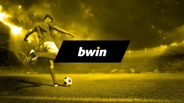 Imagem em tons de amarelo, com jogador pronto a chutar bola do lado esquerdo do campo de futebol, e logo da bwin ao centro