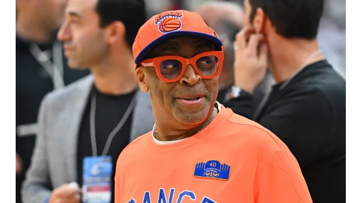 New York Knicks fan Spike Lee talks with other fans prior to a game.
