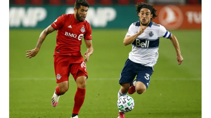 Vancouver Whitecaps vs. Toronto FC: Alejandro Pozuelo of Toronto FC (left) and Russell Teibert of the Whitecaps fight for the ball (Getty).
